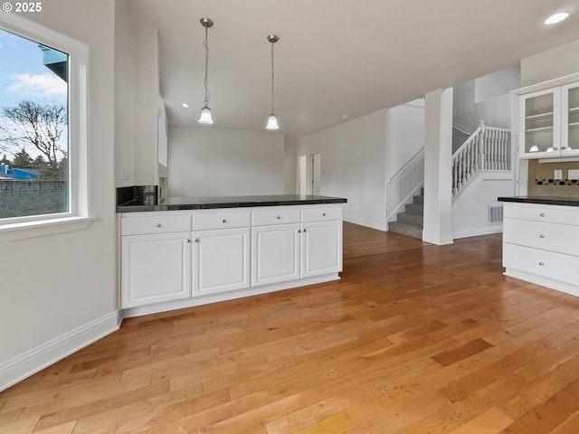 carpeted spare room featuring a textured ceiling and baseboards