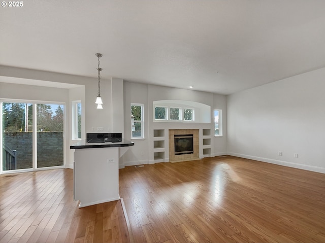 empty room featuring carpet floors, baseboards, and recessed lighting