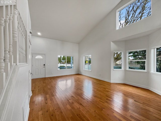 full bath with a stall shower, baseboards, stone finish floor, a garden tub, and vanity