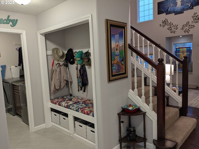 mudroom with a textured ceiling