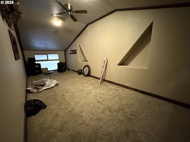 bonus room with vaulted ceiling, ceiling fan, carpet, and baseboards