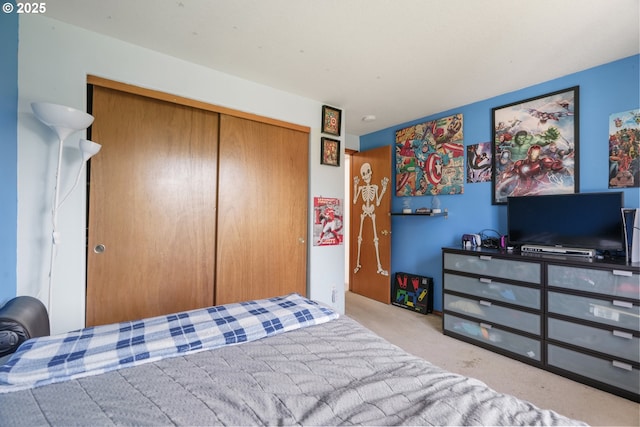 carpeted bedroom featuring a closet