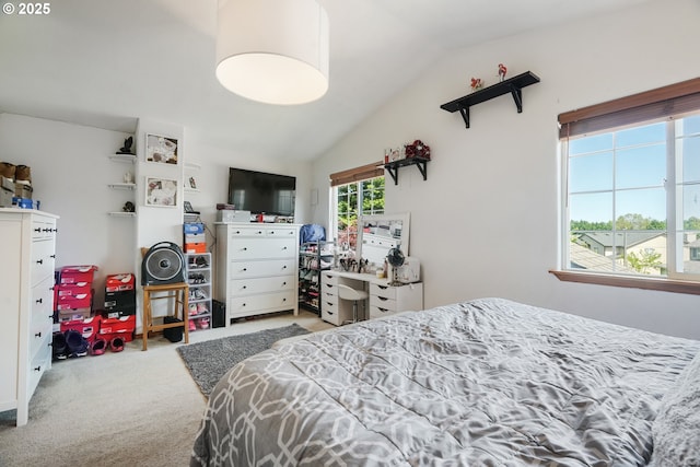 carpeted bedroom featuring vaulted ceiling