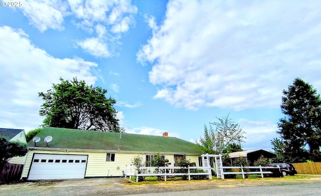 123 1st St, Dillard, OR 97432 - view of front of property with fence, an attached garage, a chimney, and driveway