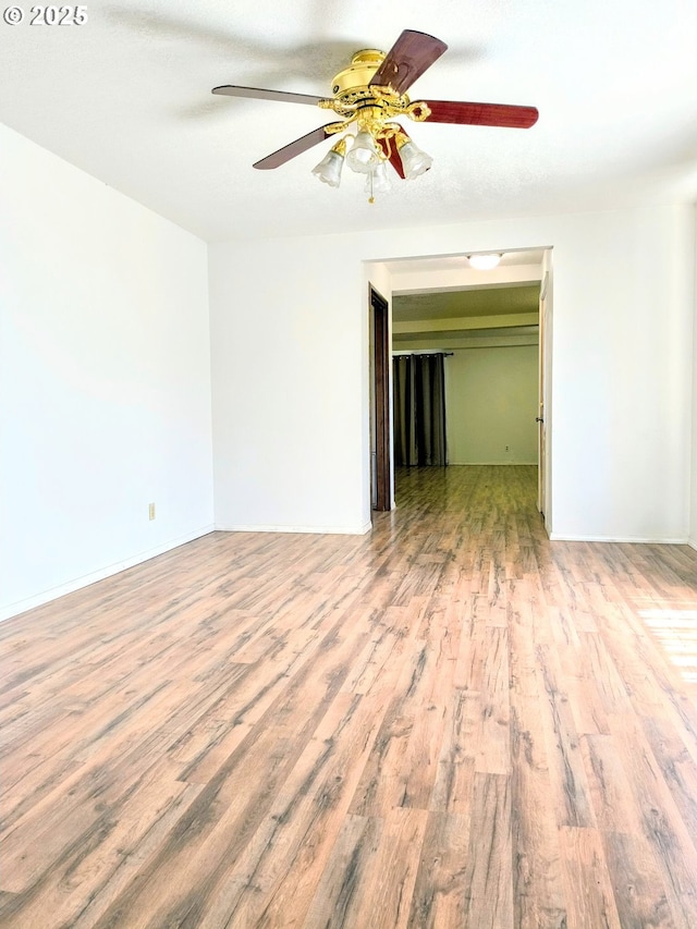 123 1st St, Dillard, OR 97432 - empty room with wood finished floors, a ceiling fan, and baseboards