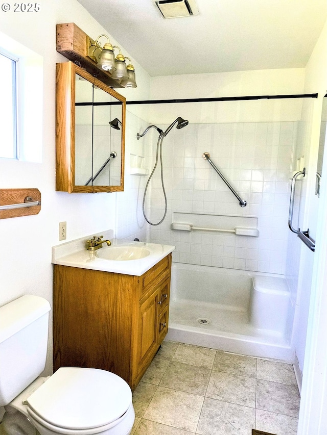 123 1st St, Dillard, OR 97432 - bathroom featuring a stall shower, toilet, vanity, and tile patterned floors