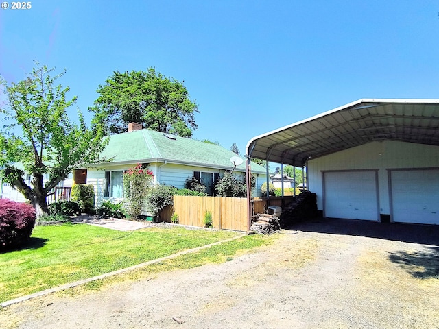 123 1st St, Dillard, OR 97432 - view of home's exterior featuring a chimney and a detached garage