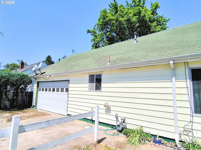 123 1st St, Dillard, OR 97432 - view of home's exterior featuring fence and roof with shingles