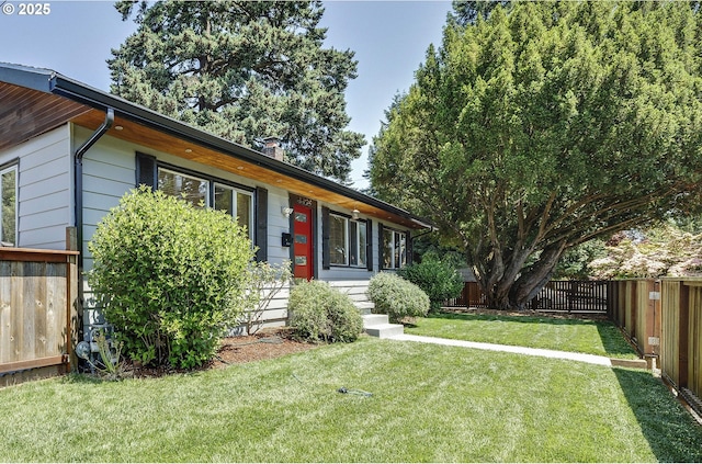 4429 SE Raymond St, Portland, OR 97206 - view of front of home with a fenced backyard and entry steps