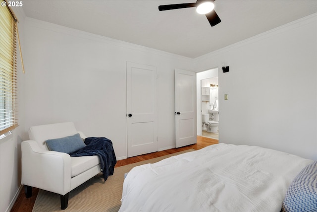 4429 SE Raymond St, Portland, OR 97206 - bedroom with wood finished floors, ornamental molding, a ceiling fan, and ensuite bath
