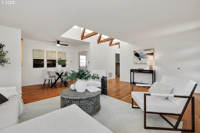 4429 SE Raymond St, Portland, OR 97206 - living area with wood finished floors, ceiling fan, and a skylight