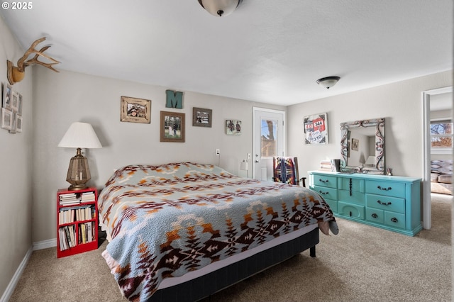 carpeted bedroom with baseboards