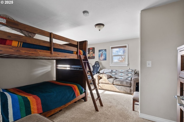 bedroom featuring carpet flooring and baseboards