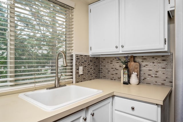 1771 NW 143rd Ave Unit 38, Portland, OR 97229 - kitchen with decorative backsplash, light countertops, and white cabinets