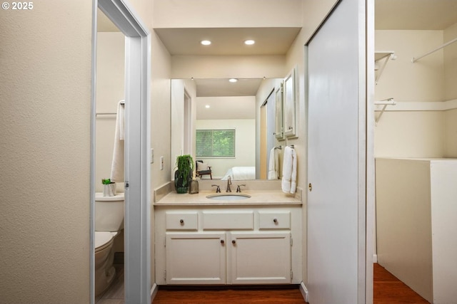 1771 NW 143rd Ave Unit 38, Portland, OR 97229 - ensuite bathroom featuring vanity, wood finished floors, and recessed lighting