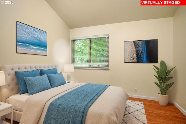 1771 NW 143rd Ave Unit 38, Portland, OR 97229 - bedroom with wood finished floors and baseboards