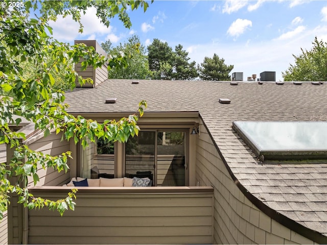 1771 NW 143rd Ave Unit 38, Portland, OR 97229 - back of house with roof with shingles, a chimney, and outdoor lounge area
