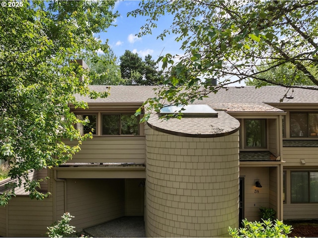 1771 NW 143rd Ave Unit 38, Portland, OR 97229 - view of home's exterior with a shingled roof