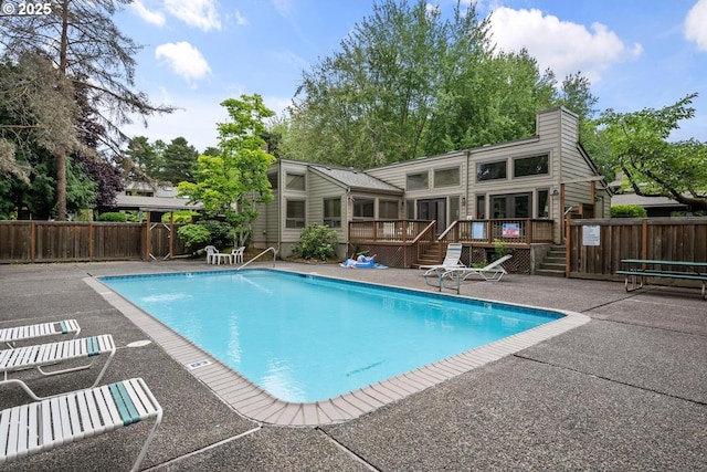 1771 NW 143rd Ave Unit 38, Portland, OR 97229 - community pool featuring a wooden deck, a patio area, and french doors