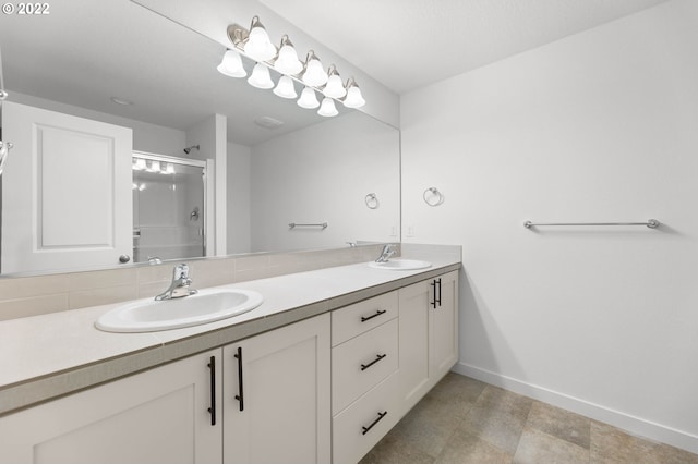 bathroom with vanity and a shower with shower door