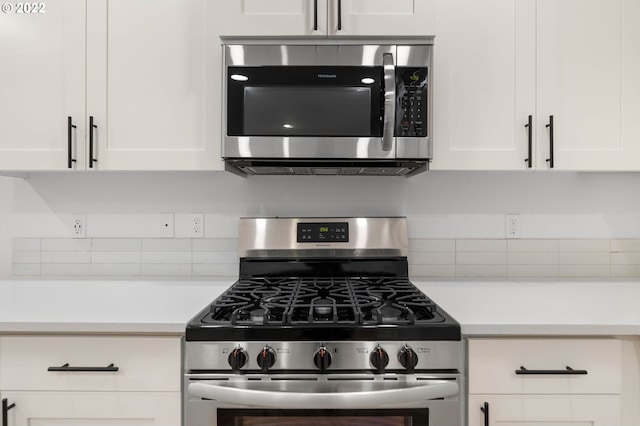 kitchen featuring stainless steel appliances and white cabinets