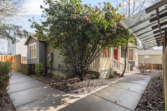 view of front of property featuring fence