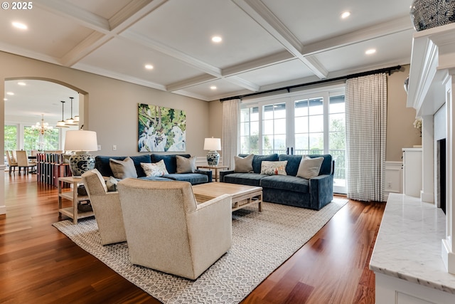 2030 W 34th Ave, Eugene, OR 97405 - living area featuring coffered ceiling, wood finished floors, beam ceiling, arched walkways, and a chandelier