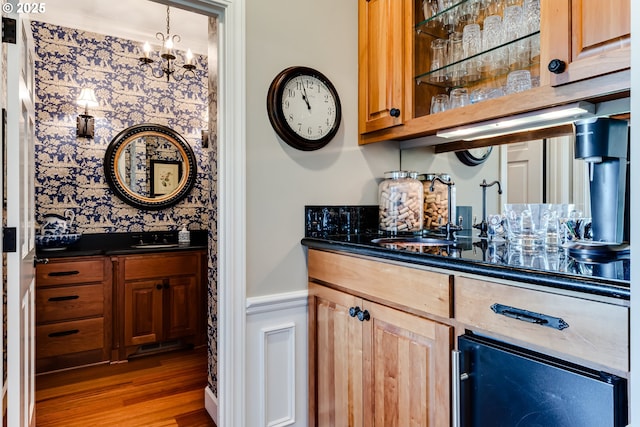 2030 W 34th Ave, Eugene, OR 97405 - indoor bar with wainscoting, wood finished floors, and a chandelier