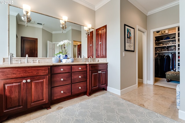2030 W 34th Ave, Eugene, OR 97405 - bathroom with ornamental molding, double vanity, a chandelier, baseboards, and a spacious closet