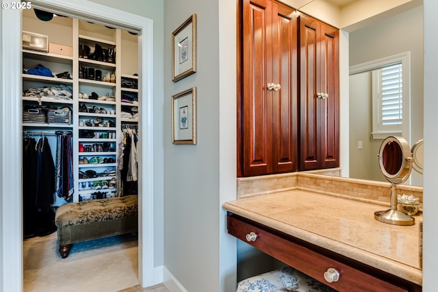 2030 W 34th Ave, Eugene, OR 97405 - bathroom featuring tasteful backsplash, baseboards, and a spacious closet