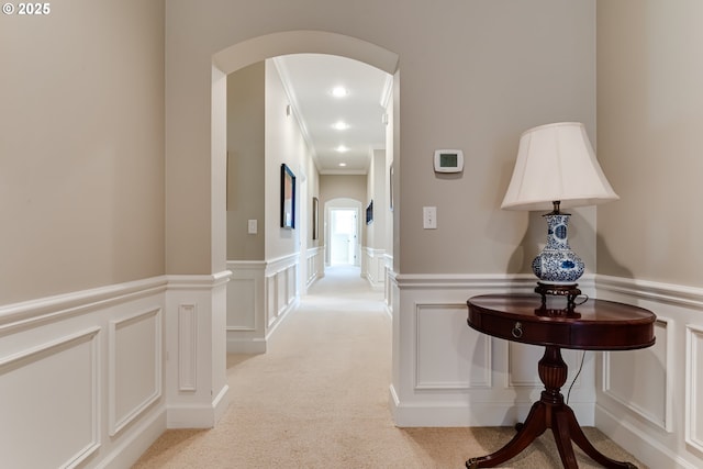 2030 W 34th Ave, Eugene, OR 97405 - corridor with arched walkways, a decorative wall, light colored carpet, wainscoting, and ornamental molding