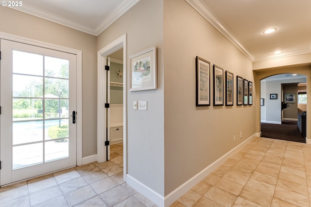 2030 W 34th Ave, Eugene, OR 97405 - doorway to outside with crown molding, arched walkways, light tile patterned floors, recessed lighting, and baseboards