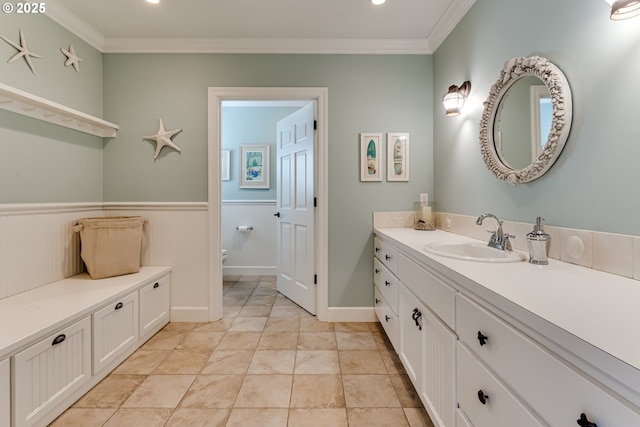 2030 W 34th Ave, Eugene, OR 97405 - bathroom with crown molding, vanity, toilet, and wainscoting