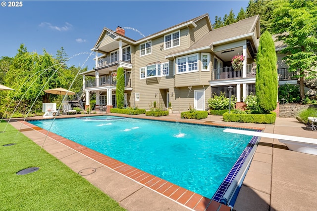 2030 W 34th Ave, Eugene, OR 97405 - swimming pool featuring a diving board and a patio