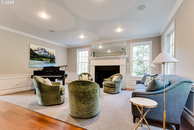 2030 W 34th Ave, Eugene, OR 97405 - living room with crown molding, wood finished floors, plenty of natural light, a fireplace, and wainscoting