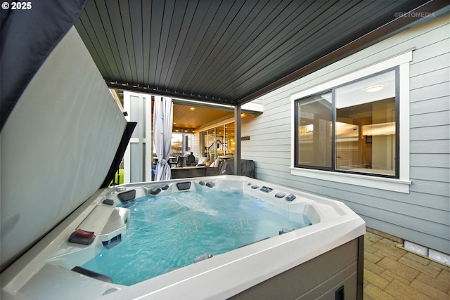 exterior space featuring a hot tub