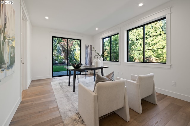 office with baseboards, light wood-style flooring, and recessed lighting