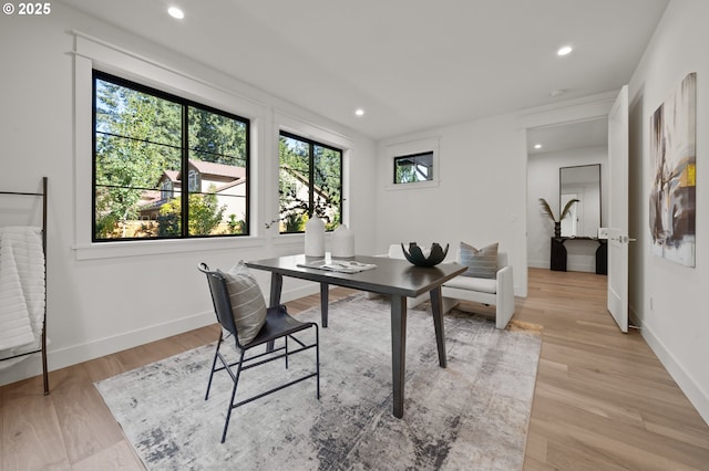 office space featuring recessed lighting, light wood-style floors, and baseboards