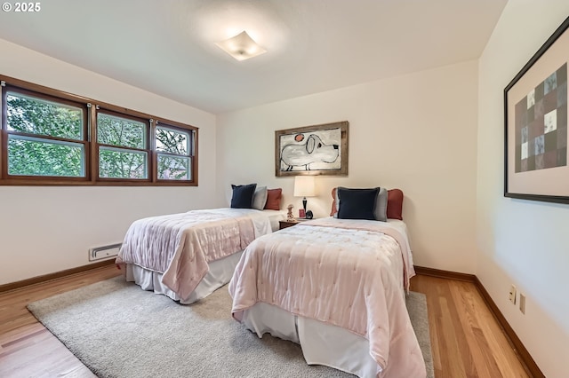 4645 NE 42nd Ave, Portland, OR 97218 - bedroom featuring wood finished floors and a baseboard radiator