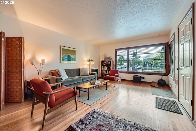 4645 NE 42nd Ave, Portland, OR 97218 - living area featuring light wood-style floors and a textured ceiling