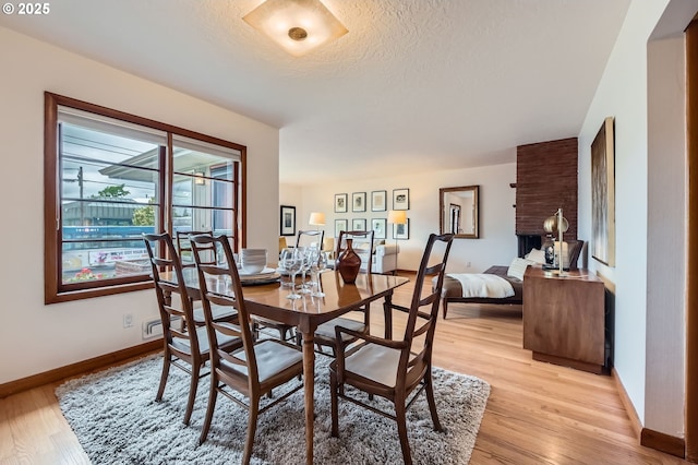 4645 NE 42nd Ave, Portland, OR 97218 - dining area with light wood-type flooring and a textured ceiling