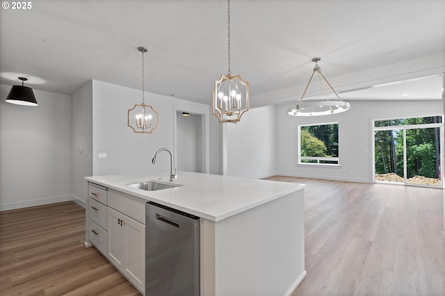 14196 SE Iseli Ln, Clackamas, OR 97015 - kitchen featuring dishwasher, light wood finished floors, white cabinets, and a chandelier