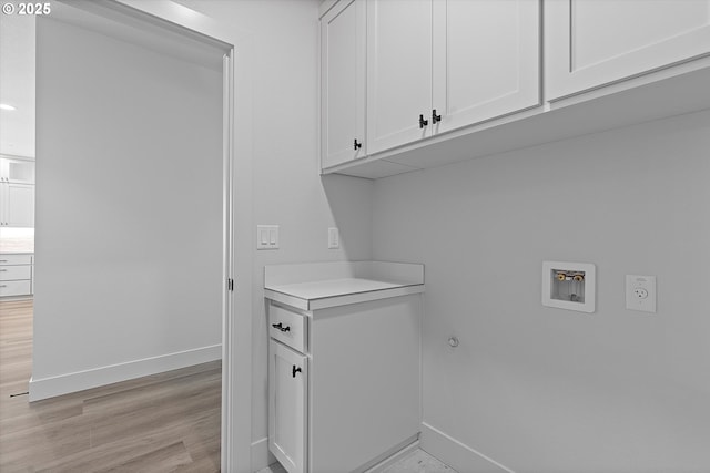 14196 SE Iseli Ln, Clackamas, OR 97015 - laundry area featuring cabinet space, hookup for a washing machine, and light wood finished floors