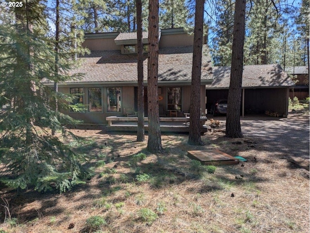 70710 Steeple Bush, Sisters, OR 97759 - rear view of property featuring a shingled roof and a carport