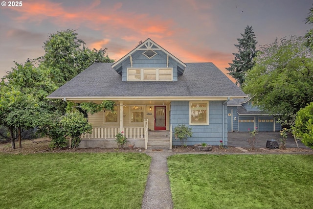 2822 Crocker Rd, Eugene, OR 97404 - view of front of home with covered porch, a front yard, a shingled roof, and a garage