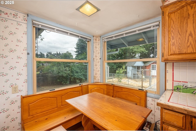 2822 Crocker Rd, Eugene, OR 97404 - dining area featuring wallpapered walls and healthy amount of natural light