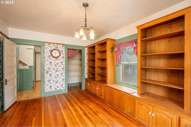 2822 Crocker Rd, Eugene, OR 97404 - unfurnished dining area featuring wood finished floors and a chandelier