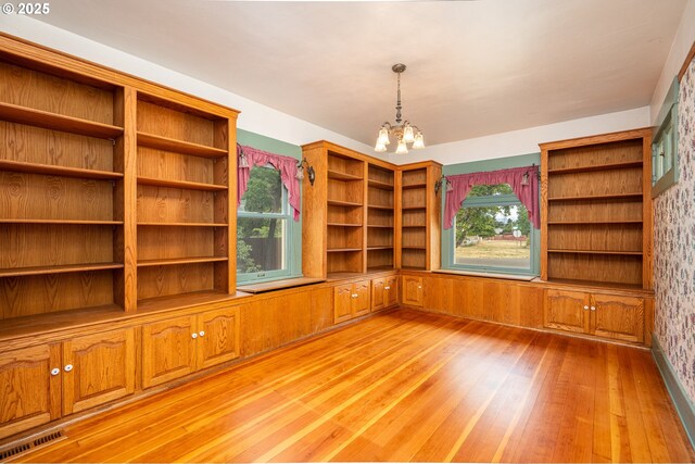 2822 Crocker Rd, Eugene, OR 97404 - empty room featuring a chandelier and light wood finished floors
