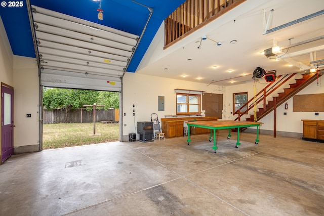 2822 Crocker Rd, Eugene, OR 97404 - garage featuring electric panel and a wood stove