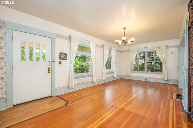 2822 Crocker Rd, Eugene, OR 97404 - foyer featuring a chandelier, wood finished floors, and healthy amount of natural light